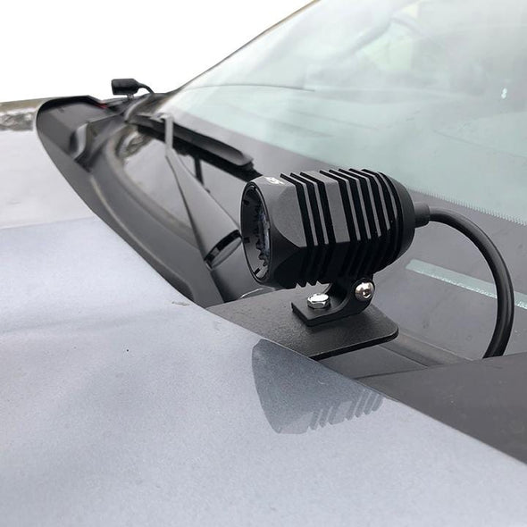 An image of an APS H1 light pod mounted on the hood of a 2019 Chevy Silverado